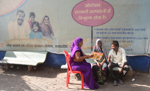 An accredited social health activist trained by staff from the Ipas Development Foundation counsels a couple on family planning methods in India.