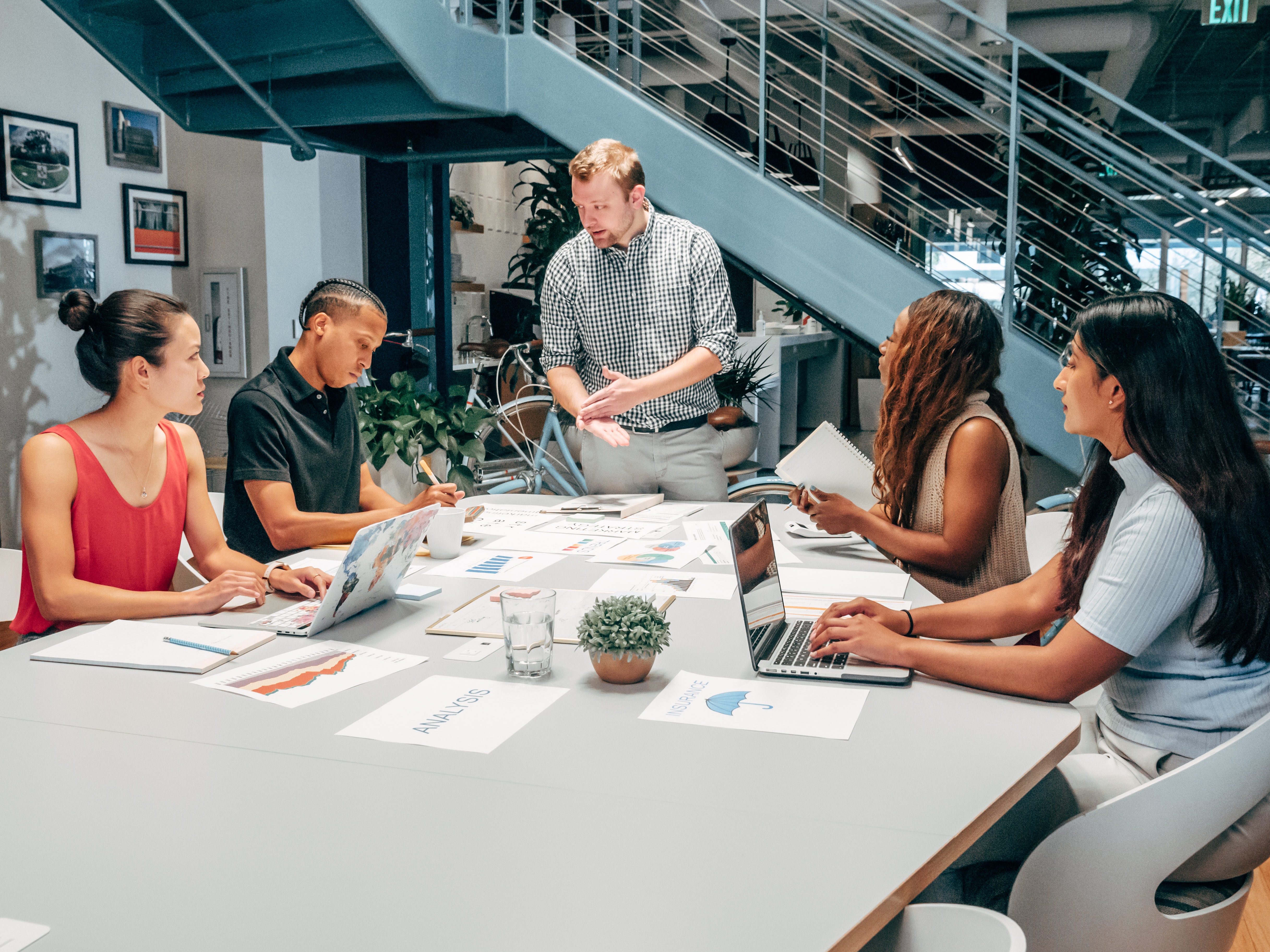 team of employees in a meeting to discuss data