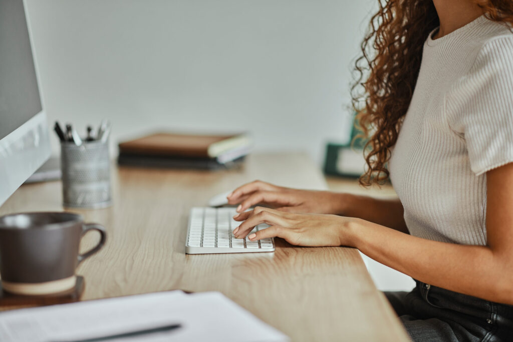 typing on the computer copywriting marketing desk work at home