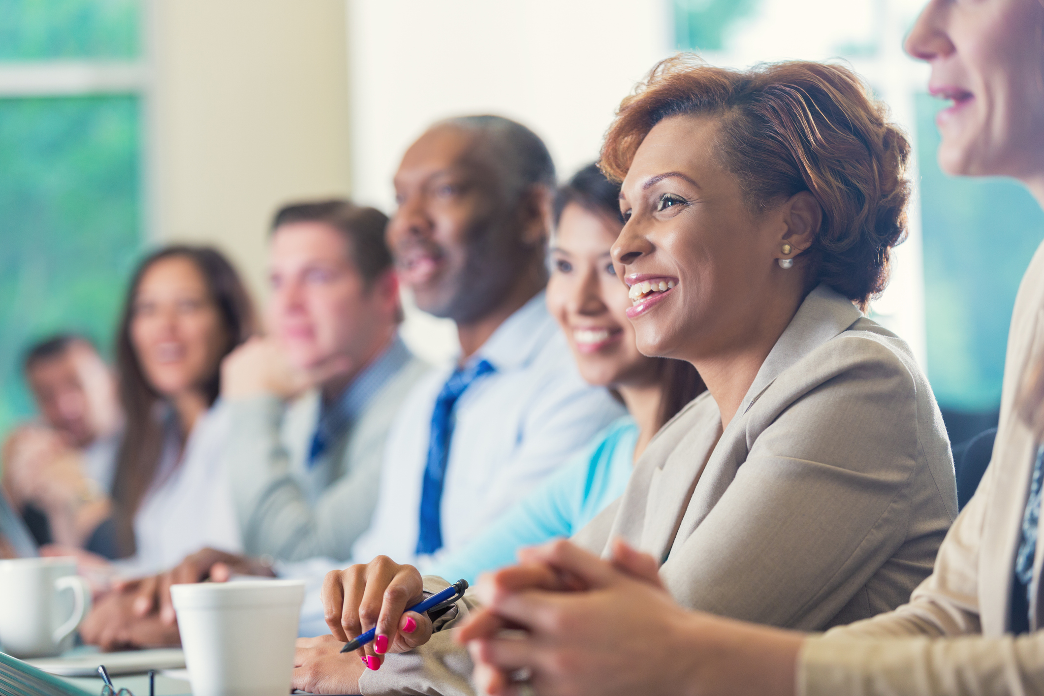 woman in a board meeting discussing strategic planning